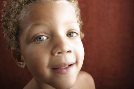 Portrait of a handsome young boy with curly hairの写真素材