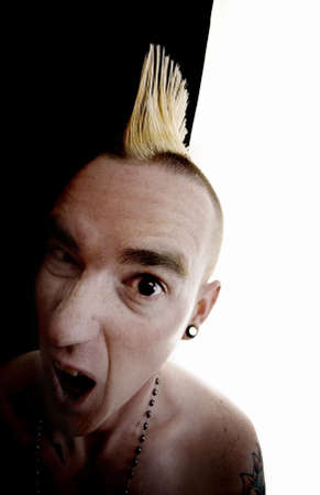 Surprised shirtless man with a Mohawk hair styleの写真素材