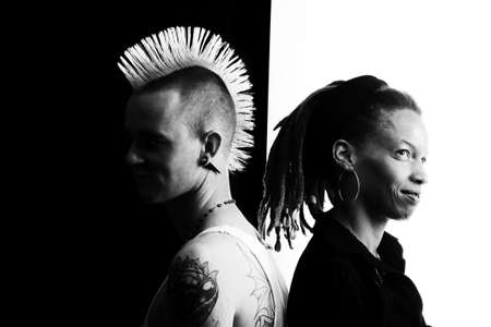 African-American Woman and Caucasian Man on Black and White Backgroundの写真素材