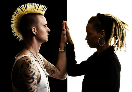 Caucasian Man with Mohawk and African-American Woman with Dreadlocksの写真素材