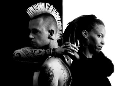 Caucasian Man with Mohawk and African-American Woman with Dreadlocksの写真素材