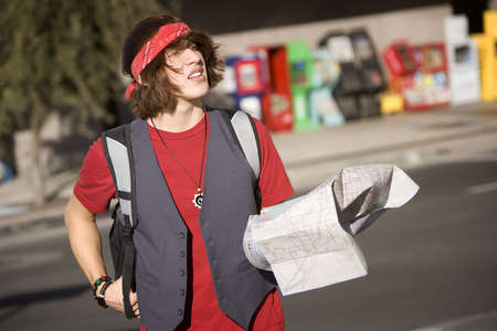 Handsome Young Male Tourist with Crumpled Map