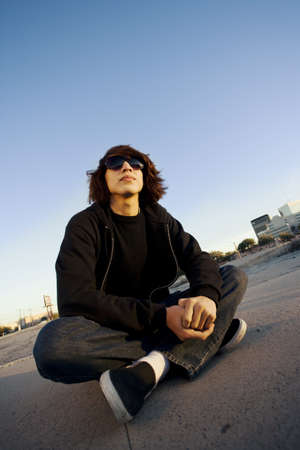 Teenage boy wearing glasses in urban setting