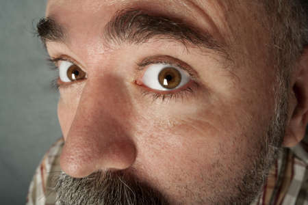 Extreme closeup of a man in his forties with mustacheの写真素材