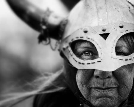 Closeup portrait of Viking woman in helmet with hornsの写真素材