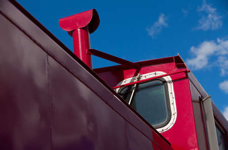 Detail of a shiny red train cabooseの写真素材