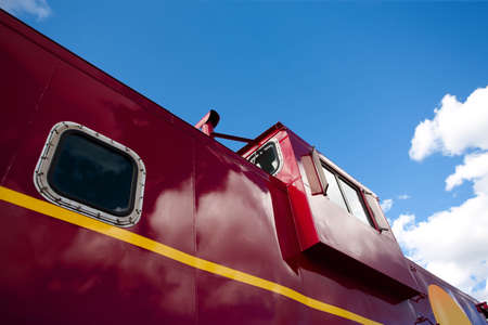 Detail of a shiny red train cabooseの写真素材