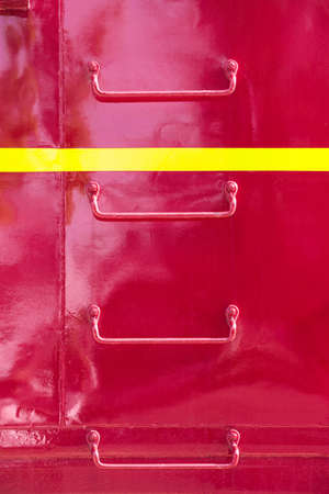 Metal ladder rungs on the side of red train cabooseの写真素材