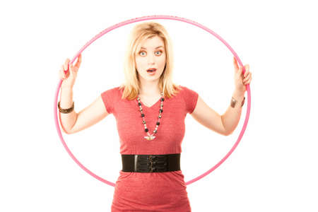 Pretty young woman in casual clothes with plastic hoopの写真素材