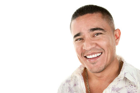 Closeup portrait of smiling Hispanic man on whiteの写真素材