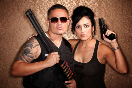 Attractive male and female undercover cops with firearmsの写真素材