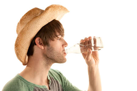 Handsome man drinking water on white backgroundの写真素材