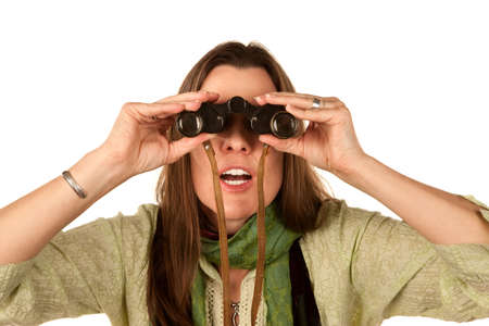 Adult woman looking through vintage binocularsの写真素材