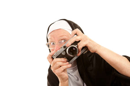 Funny nun with camera on white backgroundの写真素材
