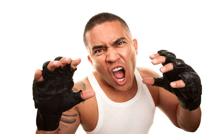 Hispanic man in t-shirt wearing mixed martial arts gloves