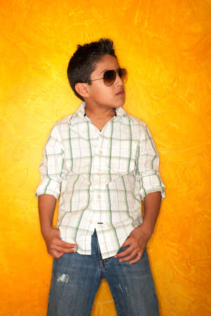 Handsome young Hispanic boy wearing sunglassesの写真素材