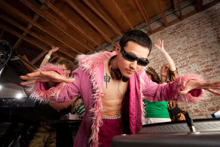 Cool Asian DJ at a 1970s Disco Music Partyの写真素材