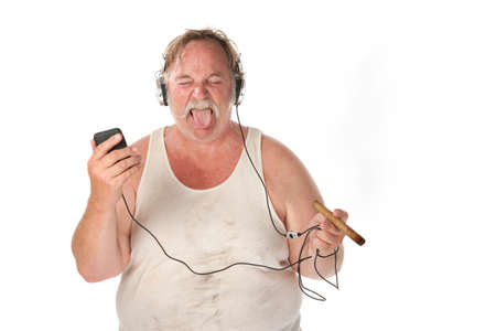 Sloppy looking man with cigar and mp3 playerの写真素材