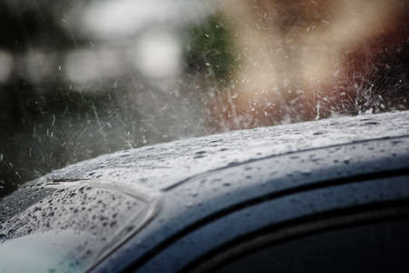 Rain on a car roof in the background in Costa Ricaの写真素材