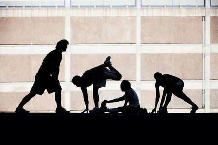 Group of runners stretching before race.の写真素材