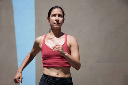 Determined woman runs for a healthy lifestyle.