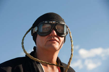 Man with knit cap, goggles and headdressの写真素材