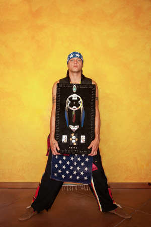 Handsome Native American man with his personal artworkの写真素材