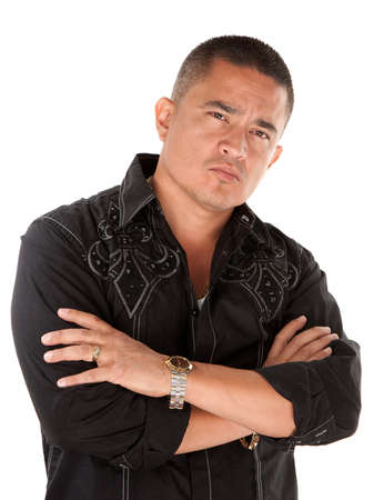 Native American looking tough with folded arms on white backgroundの写真素材