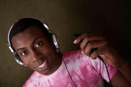 Handsome Black man with headphones and mp3 player