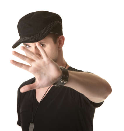 Young man tries to cover his face over white backgroundの写真素材