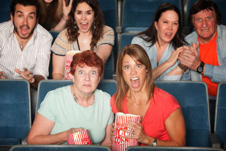 Scared people in the audience with their mouths open