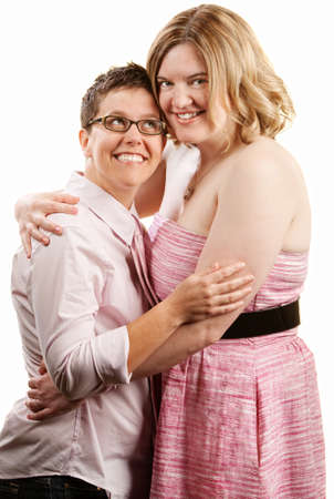 Happy lady looks up to her female companionの写真素材