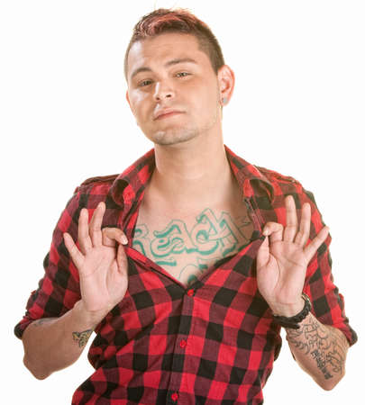 Cute young man over white showing off chest tattooの写真素材