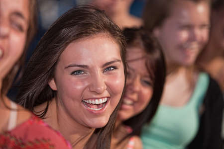 Close up of laughing Caucasian teenage girls outdoorsの写真素材
