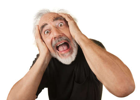 Screaming man covering his ears over white background
