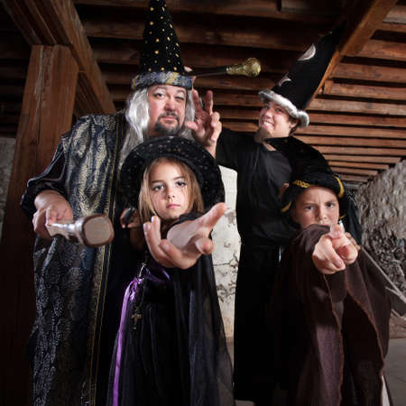 Cute family of people dressed in Halloween costumesの写真素材