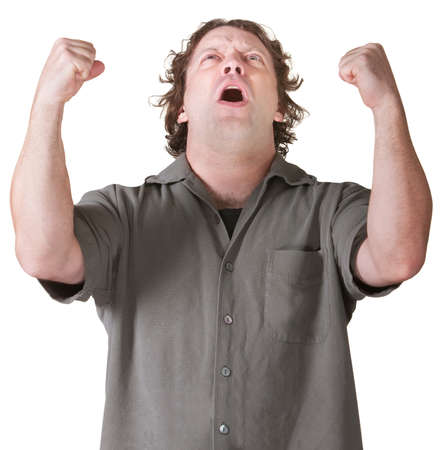 Emotional man screaming with fists in mid air