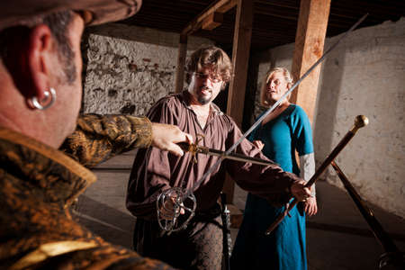 European Renaissance hero defending woman against swordsman