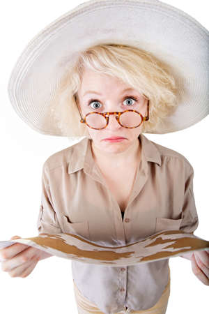 Isolated female safari traveler holding a mapの写真素材