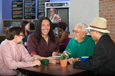 Men from various ethnic groups and ages in cafe