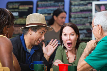 Diverse group of adults ashamed and listening to man