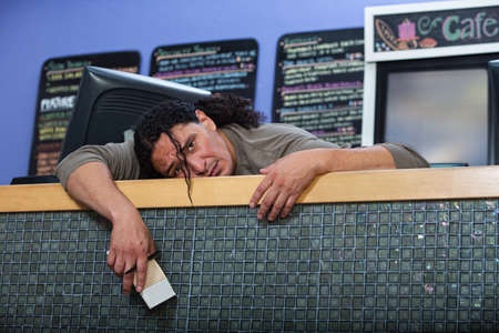 Tired Native American restaurant owner at counterの写真素材