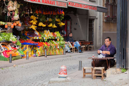 Istanbul, TURKEY â APRIL 28: Man enjoys apple tea on a sidewalk on April 28 2012 in Istanbul, Turkey.  Each year patriotic Turks honor those fallen at the battle of Galipoli during World War I.のeditorial素材