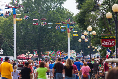 DES MOINES, IA /USA - AUGUST 10: Attendees at the Iowa State Fair. Thousands of people filling the midway at the Iowa State Fair on August 10, 2014 in Des Moines, Iowa, USA.のeditorial素材