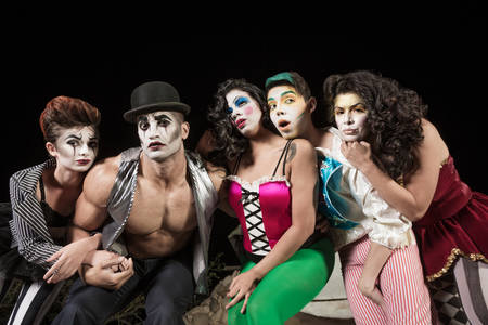 Five serious cirque clowns on theater stageの写真素材