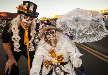 TUCSON, AZ/USA - NOVEMBER 09: Two unidentified senior people in dramatic facepaint at the All Souls Procession on November 09, 2014 in Tucson, AZ, USA.のeditorial素材
