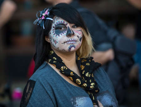TUCSON, AZ/USA - NOVEMBER 09: Unidentified young woman in facepaint at the All Souls Procession on November 09, 2014 in Tucson, AZ, USA.のeditorial素材