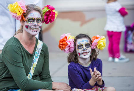 TUCSON, AZ/USA - NOVEMBER 09: Unidentified woman and girl in facepaint at the All Souls Procession on November 09, 2014 in Tucson, AZ, USA.のeditorial素材