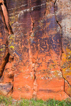 Large rock panel with many symbolic petroglyphsの写真素材