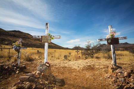 Trio of wooden crucifix burial sites with blank signsの写真素材